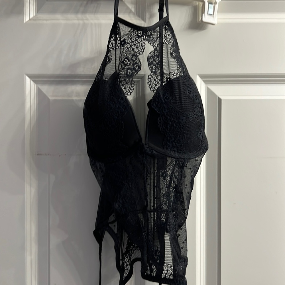 Garter belt style teddy. High lace neck, padded underwire bra. With panty.